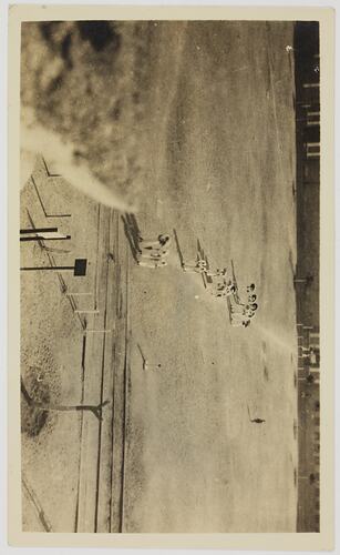 Group of woman walking across field.