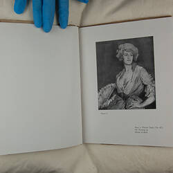 Art catalogue with image open to page 10.