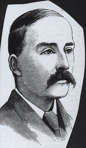Male with long dark moustache and short hair wearing dark jacket and tie with white shirt.