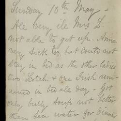 Open diary with handwritten text on discoloured worn page.