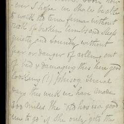 Open diary with handwritten text on discoloured worn page.