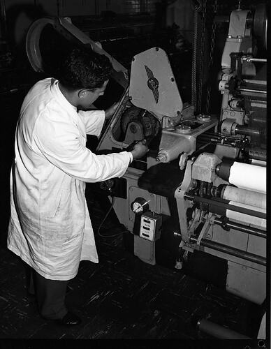 Monochrome photograph of a hoisery factory.