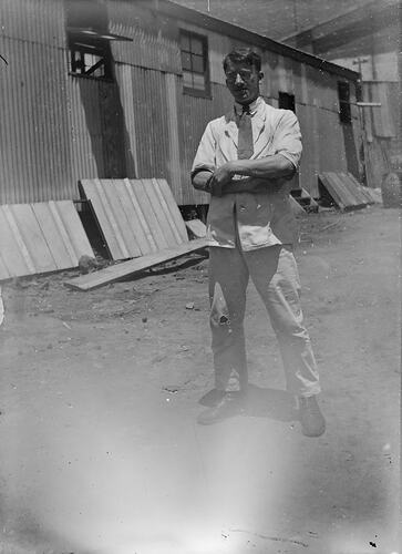 Man Behind Warehouse Crossing Arms, circa 1910s