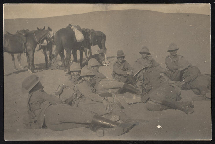 Monochrome photograph of servicemen relaxing.