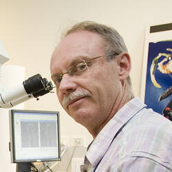 Dr Ken Walker at microscope.