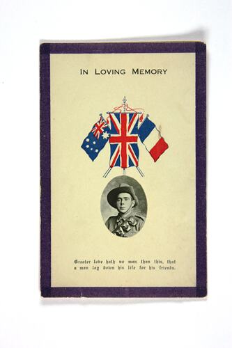 Front of card with portrait photo and coloured flags.