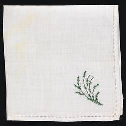 Folded handkerchief with embroidered white heather.