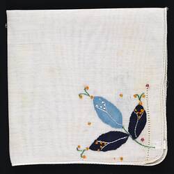Folded handkerchief with blue Applique Flowers.
