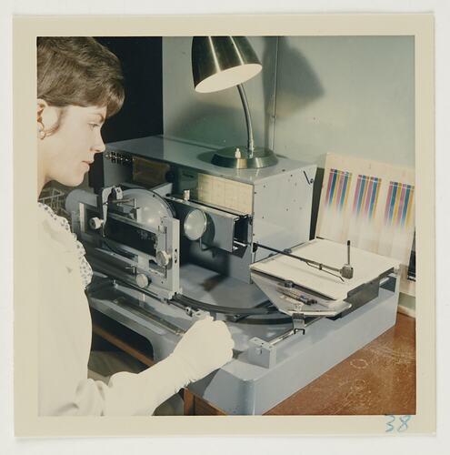 Slide 187, 'Extra Prints of Coburg Lecture', Worker Testing Characteristic Curves of Ektacolor Paper on Densitometer, Kodak Factory, Coburg, circa 1960s