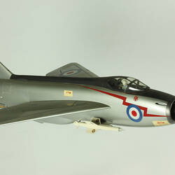 Silver model aeroplane. Blue, white and red rondels on wings and fuselage.