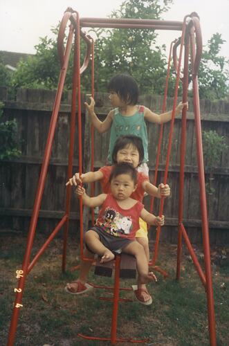 Lin Jong with his sisters Fiona and Josie in the Backyard,Tarago Crescent Clayton South, 4 Feb, 1995