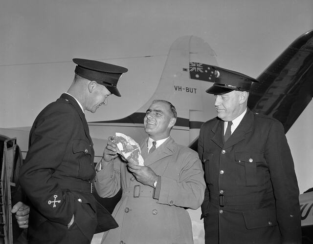 Man at Airport with Two Night Patrol Officers, Melbourne, Victoria, 1956