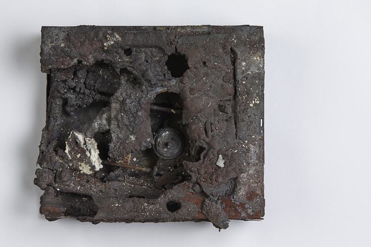Fire afffected melted computer hard drive.