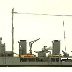 Naval ship with two masts, facing left.
