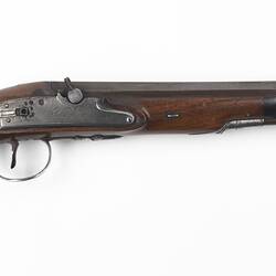 Duelling pistol, wooden with octagonal barrel, oval silver monogram plate.