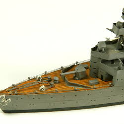 Naval ship with mast, detail of bow.