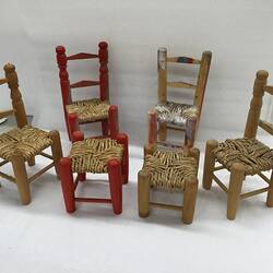 Group of six miniature timber furniture pieces.