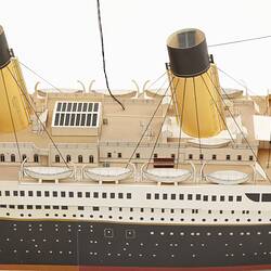 Cardboard model of passenger steamship. Detail of mid section with two funnels.