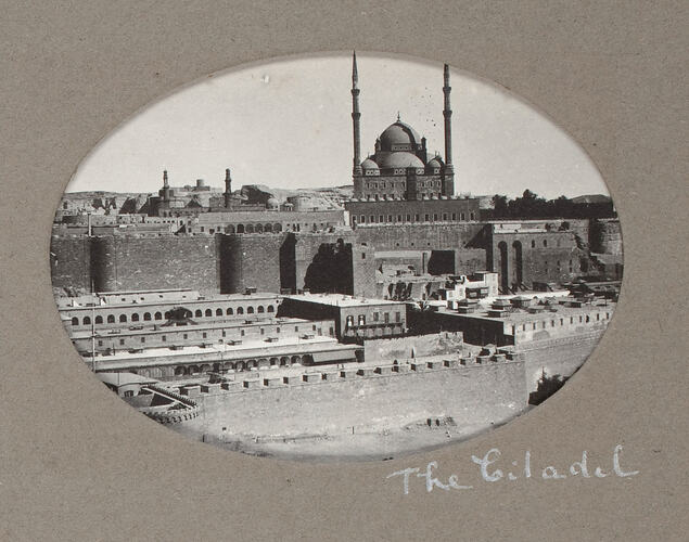 Domed citadel behind walls.
