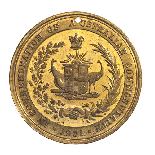 Medal with wreath crowned Australian Arms supported by emu and kangaroo. Hole at top.