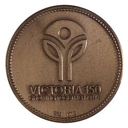 Round medal with logo of two single leaf stems supporting central inverted triangle. Text below.