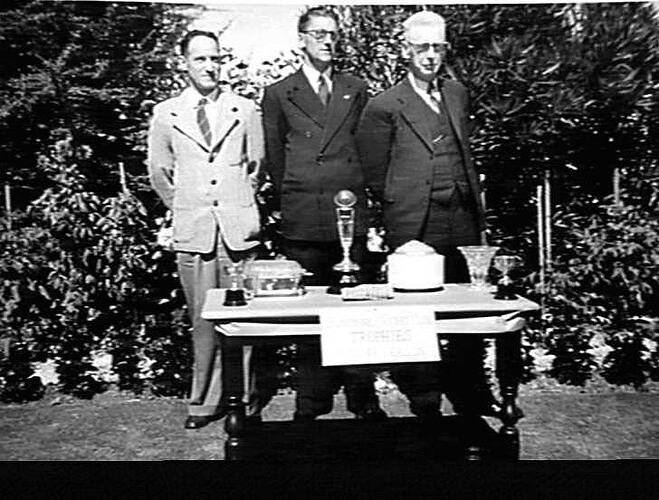 TALKING SPORT - SUNSHINE CRICKET CLUB CONCORD WEST - OFFICIALS WITH THE TROPHIES (L. TO R.): W.R. BALDWIN (CAPTAIN), G.H. BEVAN (HON.SEC.) AND L.E. MORSE (PRESIDENT): `SUNSHINE REVIEW': JUNE 1949