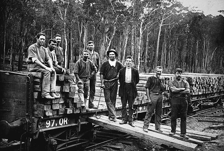 Workers unloading sleepers from rail truck, Bairnsdale district, circa 1905.