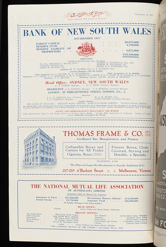 White magazine page with red and blue printed text and image of 4 storey building.