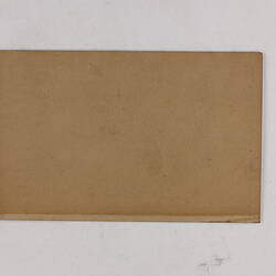 Retangular brown card.