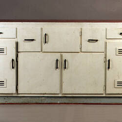 Kitchen lower cupboard unit with doors and drawers.