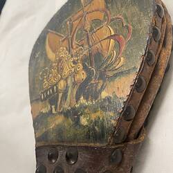 Painted ship on wooden bellows.