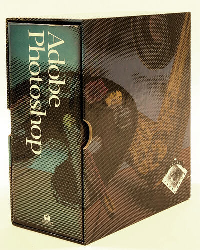 Cardboard box containing Adobe photoshop software package.