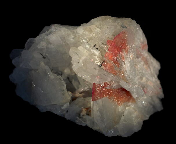White crystalline rock with pink crystals.