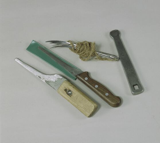Various tools used to make mats. Knives, needles and spanner.