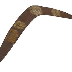 Painted wooden boomerang.
