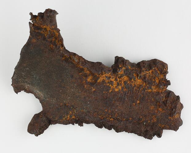 Irregular shaped piece of corroded iron.