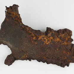 Irregular shaped piece of corroded iron.