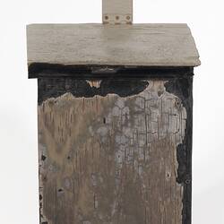 Fire damaged off-white painted wooden box with flip top lid.