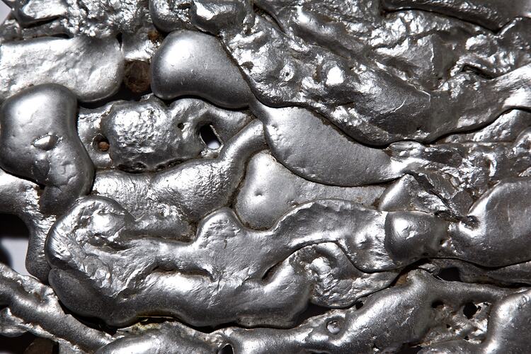 Digital photograph - Pool of melted alloy, close-up, Healesville, Mar 2009.