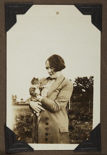 Portrait of a Woman Holding a Cat, England, circa 1929