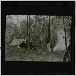 Black and white photograph of women in a bush camp.