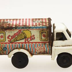 White toy ice-cream truck, right view.