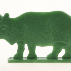 Green rhinoceros figurine, left view.