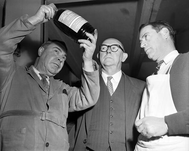 Three Employees with a Glass Bottle, Melbourne, Victoria, Jul 1958