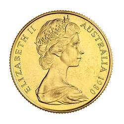 Round gold coin.