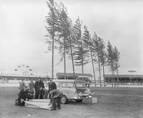 Tree Felling Demonstration, Men Standing with Motor Vehicle, Royal Melbourne Show, Flemington, Victoria, 19 Sep 1959