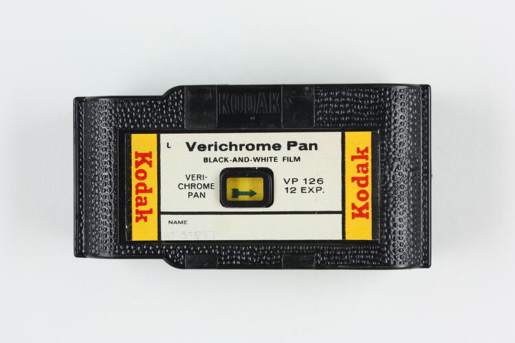 Embossed plastic film cartridge with label.