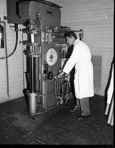 Monochrome photograph of a hoisery factory.