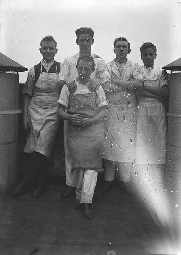 Five Men in Aprons on Roof, circa 1910s