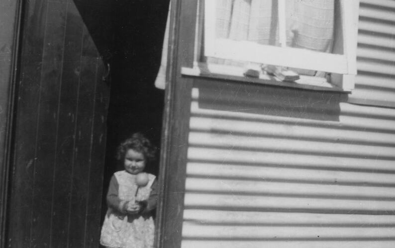 Shirley Forbes Standing in Doorway of Her House, Broadmeadows Migrant Hostel, Melbourne, 1961
